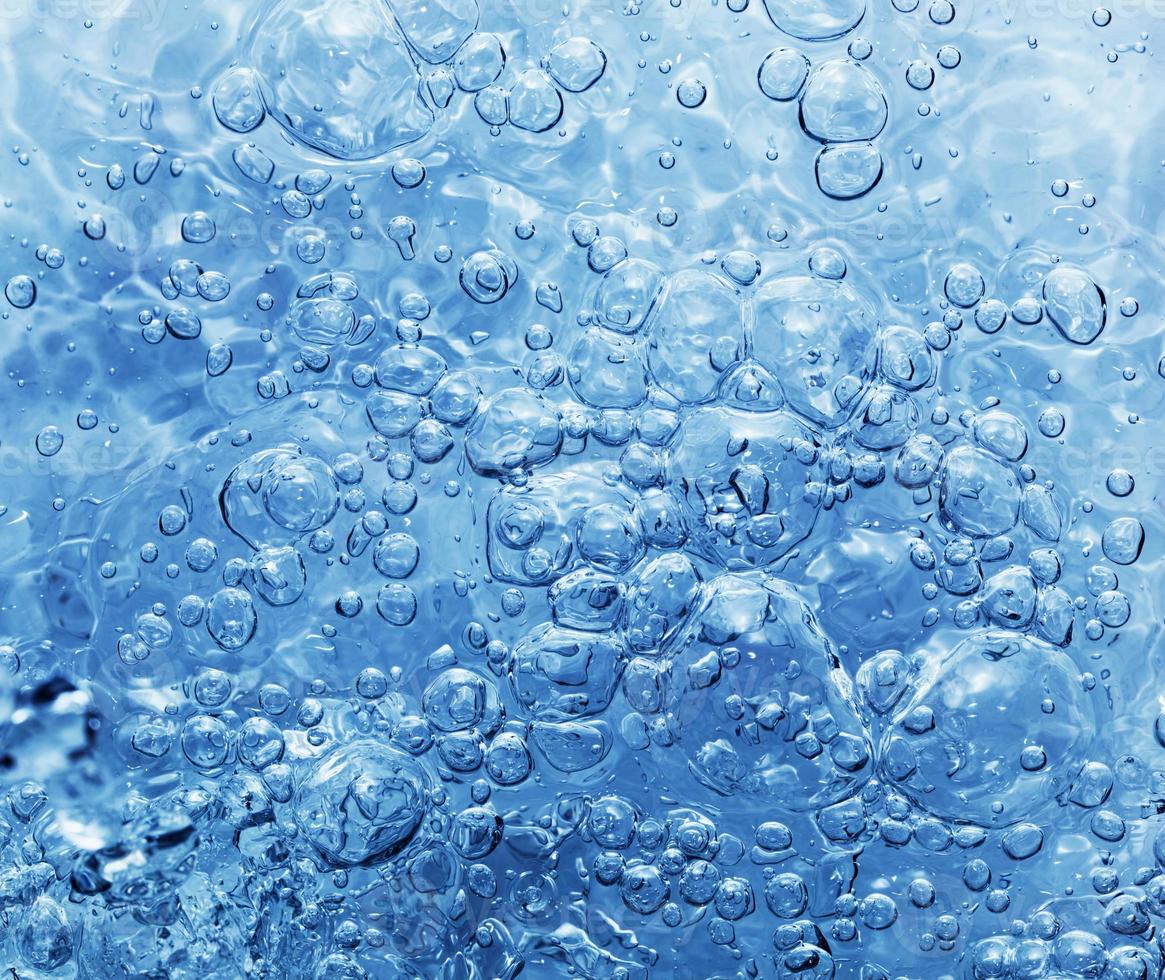 Clean water with bubbles appearing when pouring water or a splash photo