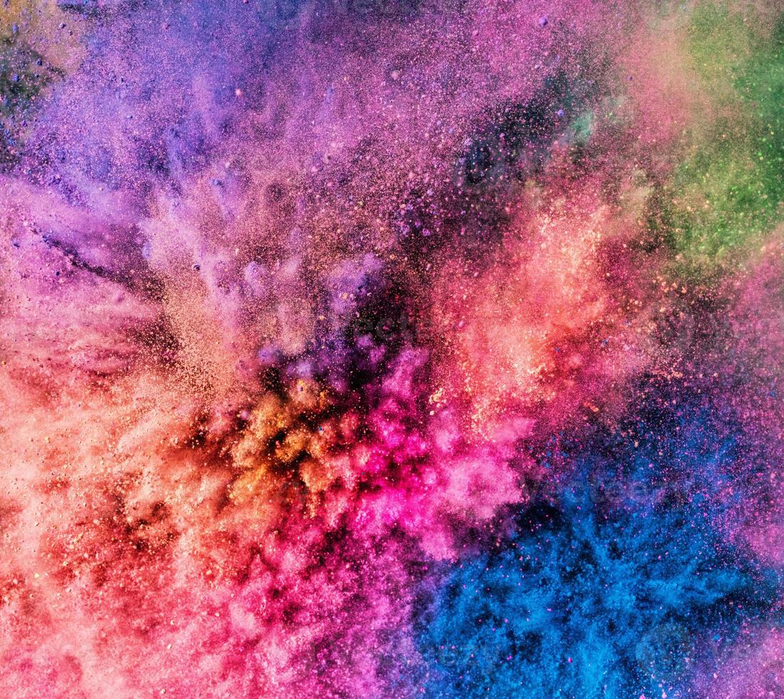 Holi powder bursting up, creating exploding texture. photo