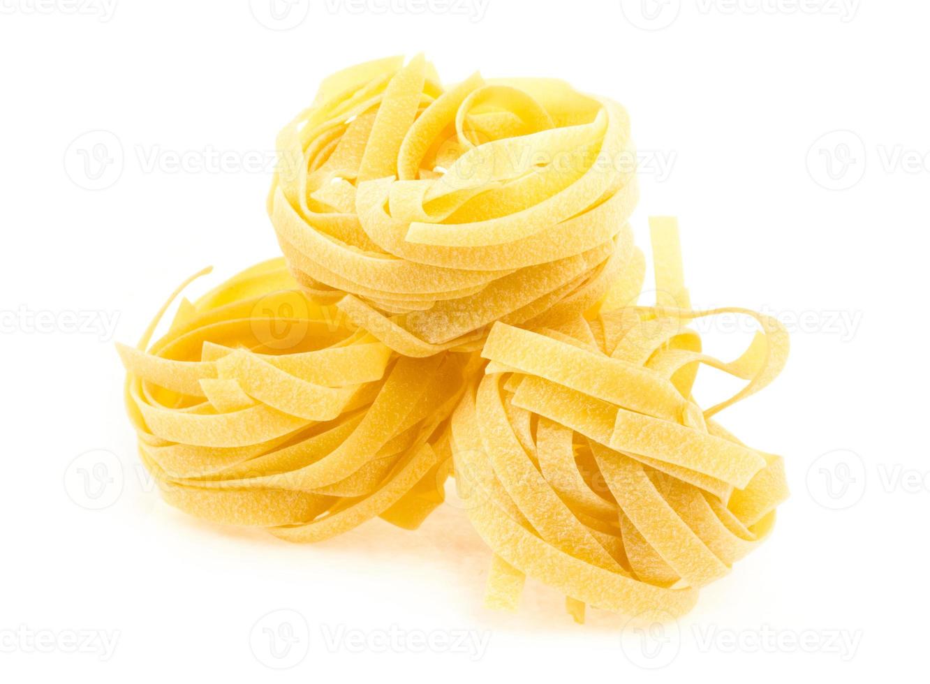 Italian pasta fettuccine nest isolated on white background photo