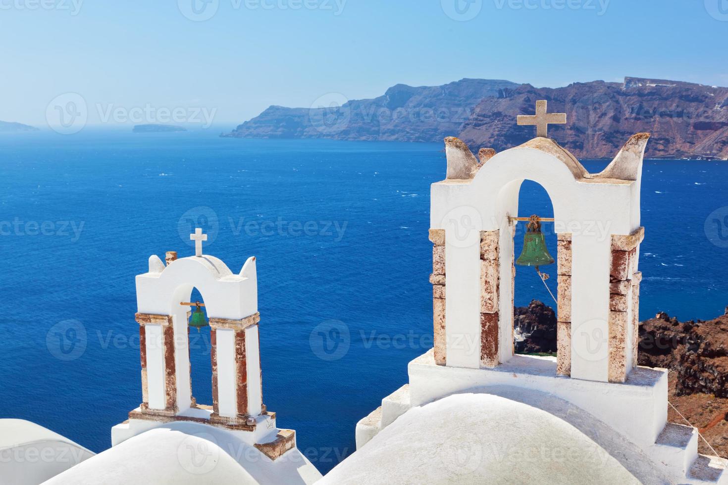 Oia town on Santorini island, Greece. Caldera on Aegean sea. photo