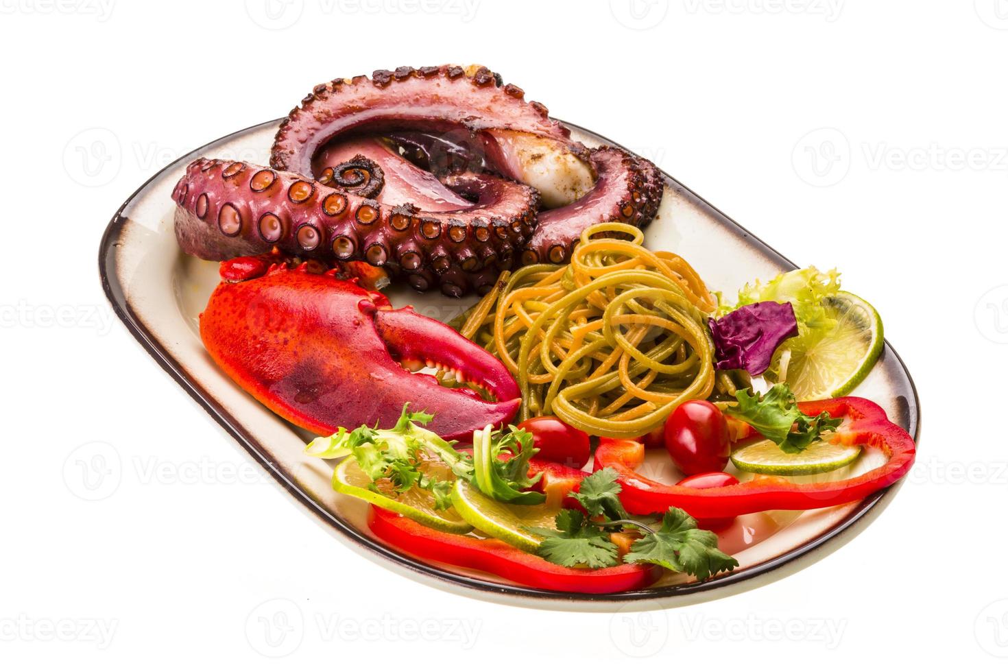 Seafood pasta with octopus and lobster leg photo