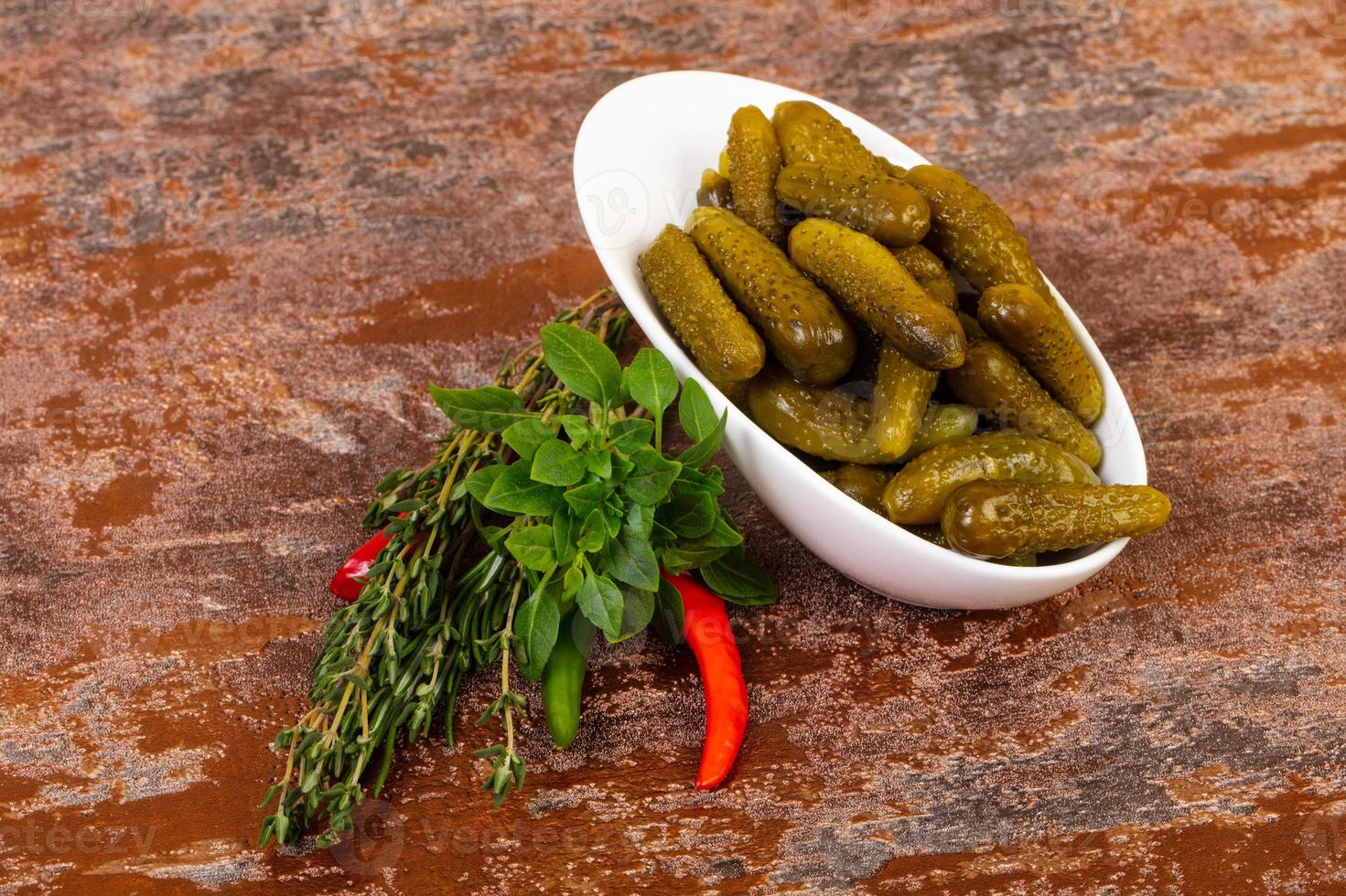 Pickled small cucumbers photo