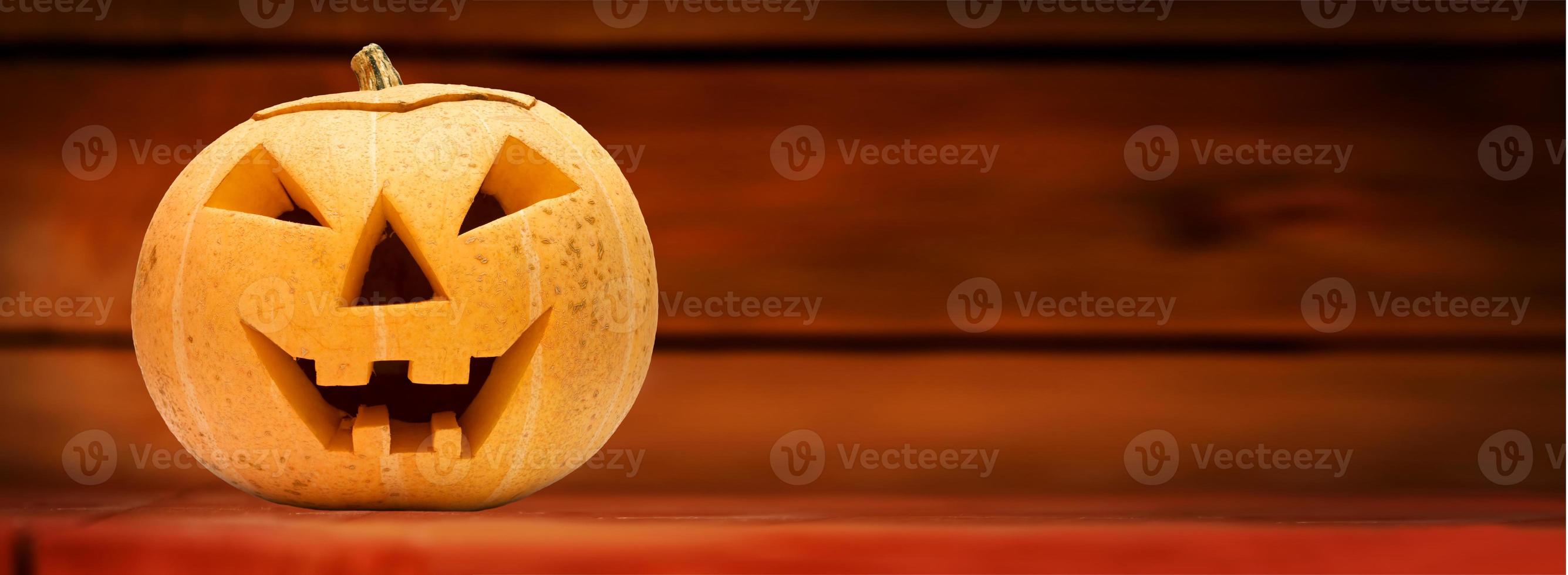 Halloween pumpkin. Wooden background photo