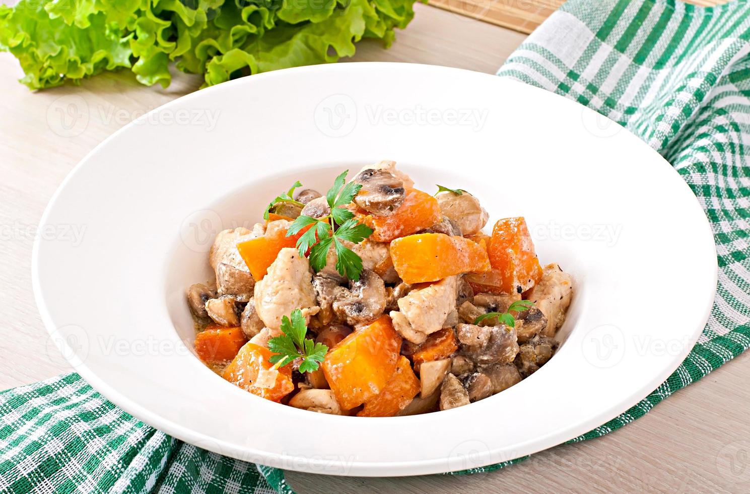 Stew chicken with vegetables and mushrooms in a cream sauce photo