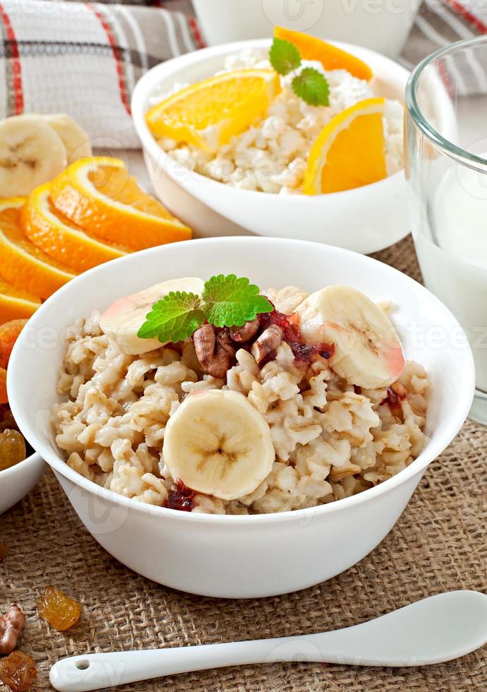 Healthy breakfast - oatmeal, cottage cheese, milk and fruit photo