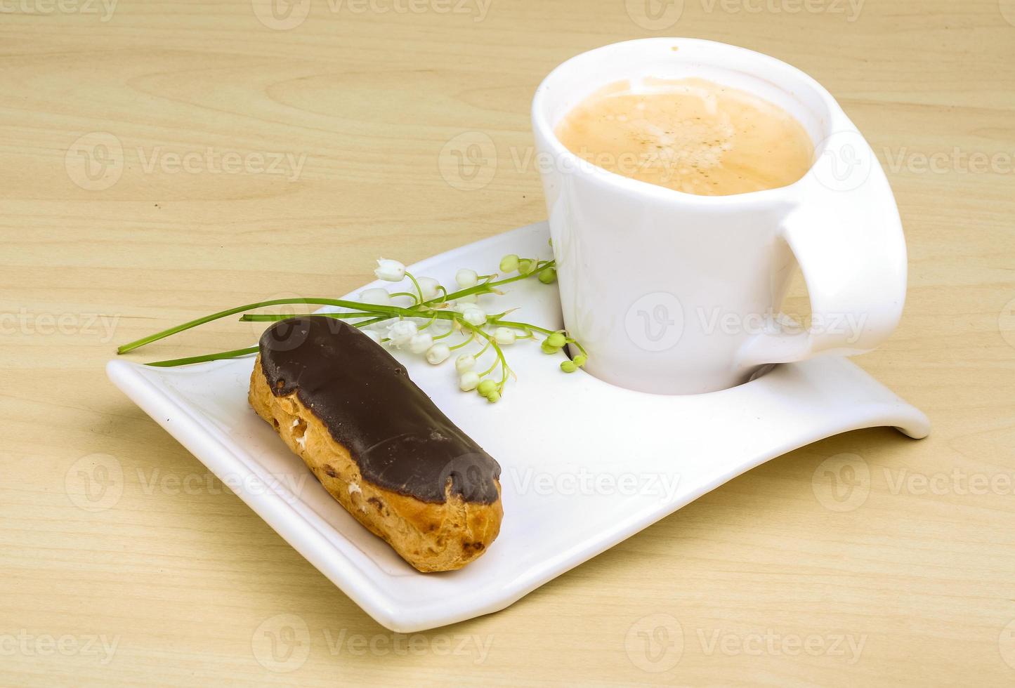 Coffee with profiterole photo