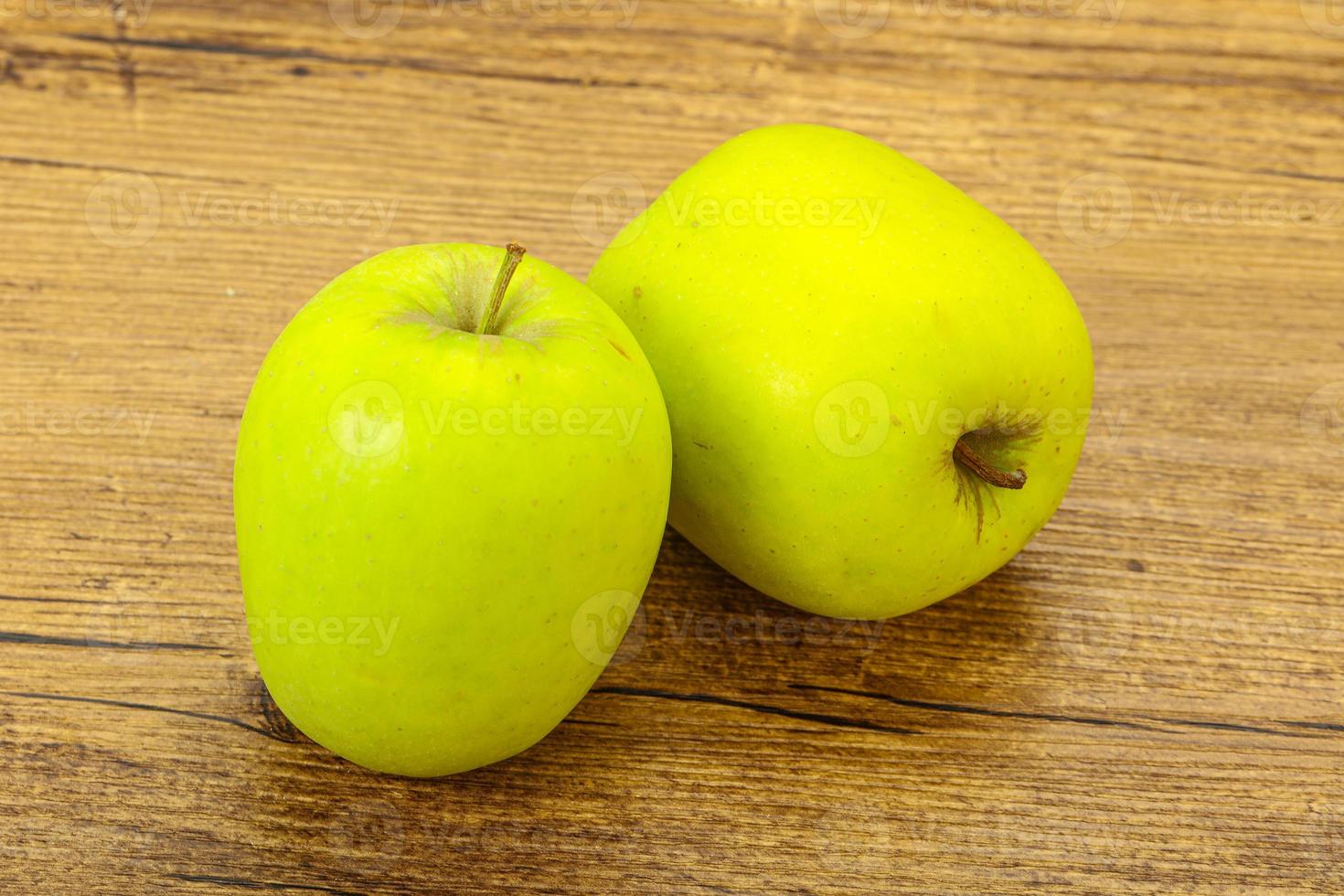 Two ripe green sweet apples photo