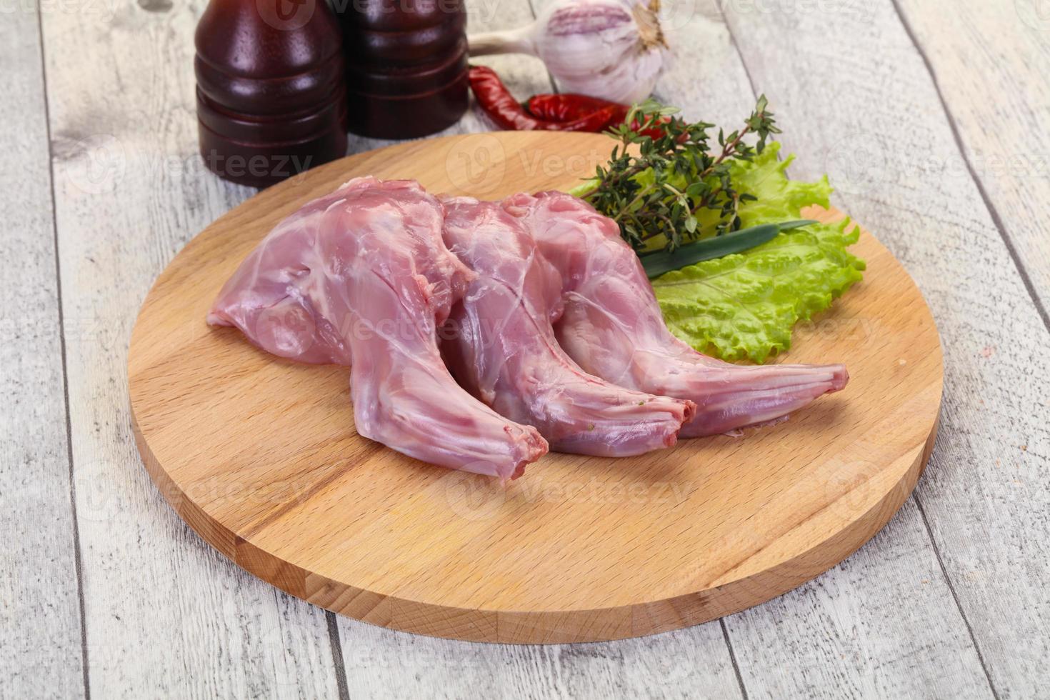 Raw rabbit legs photo