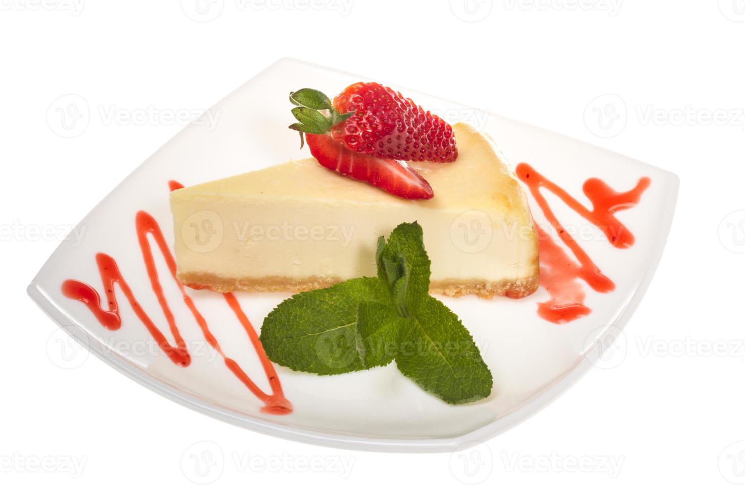 a piece of strawberry cheesecake on whit photo