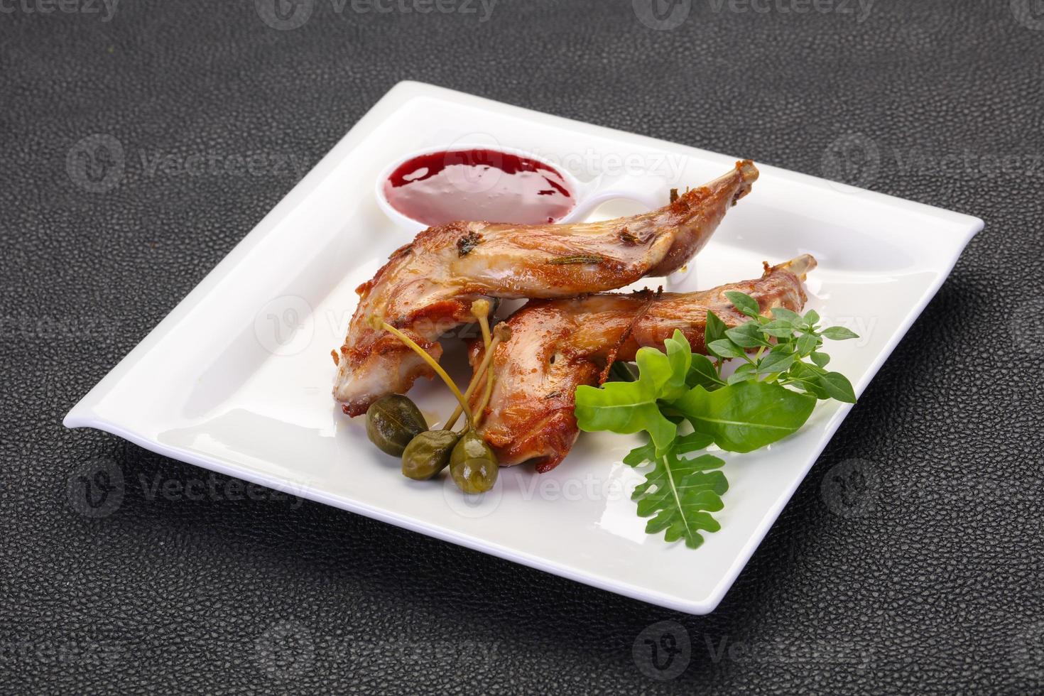 Roasted rabbit legs photo
