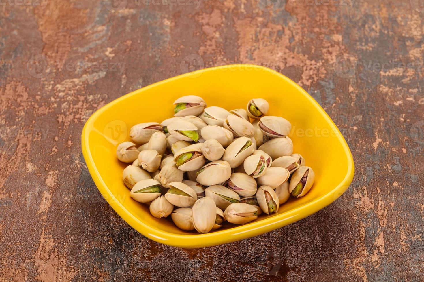 Pistachio nuts heap photo