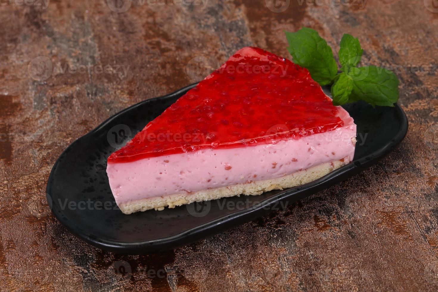 Soft Raspberry cheesecake served mint photo
