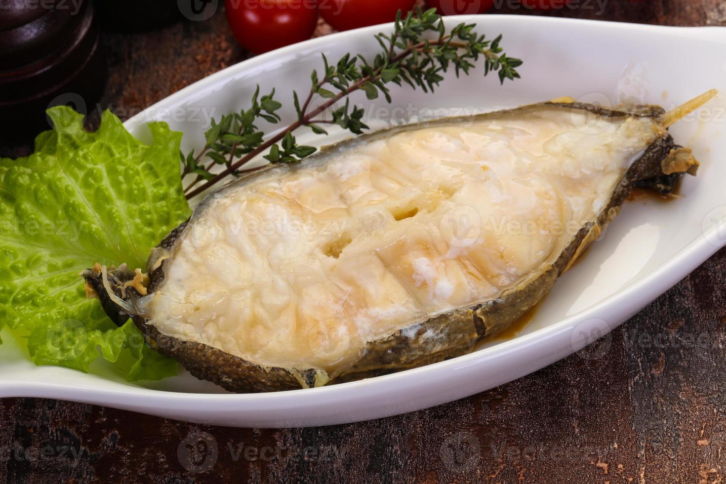 Baked wolffish steak photo