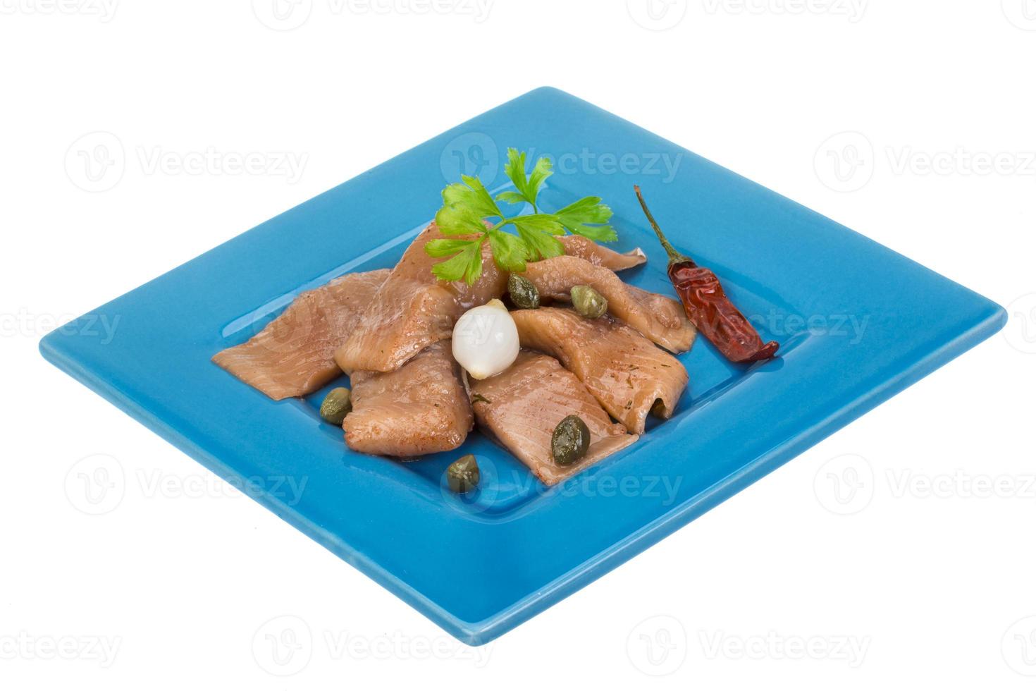 Sliced marinated herring photo