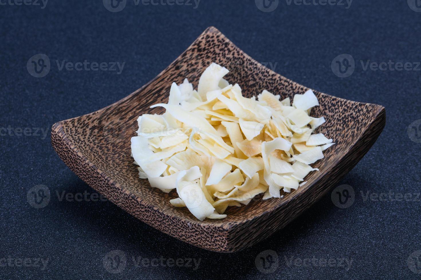 Coconut dry chips in the bowl photo