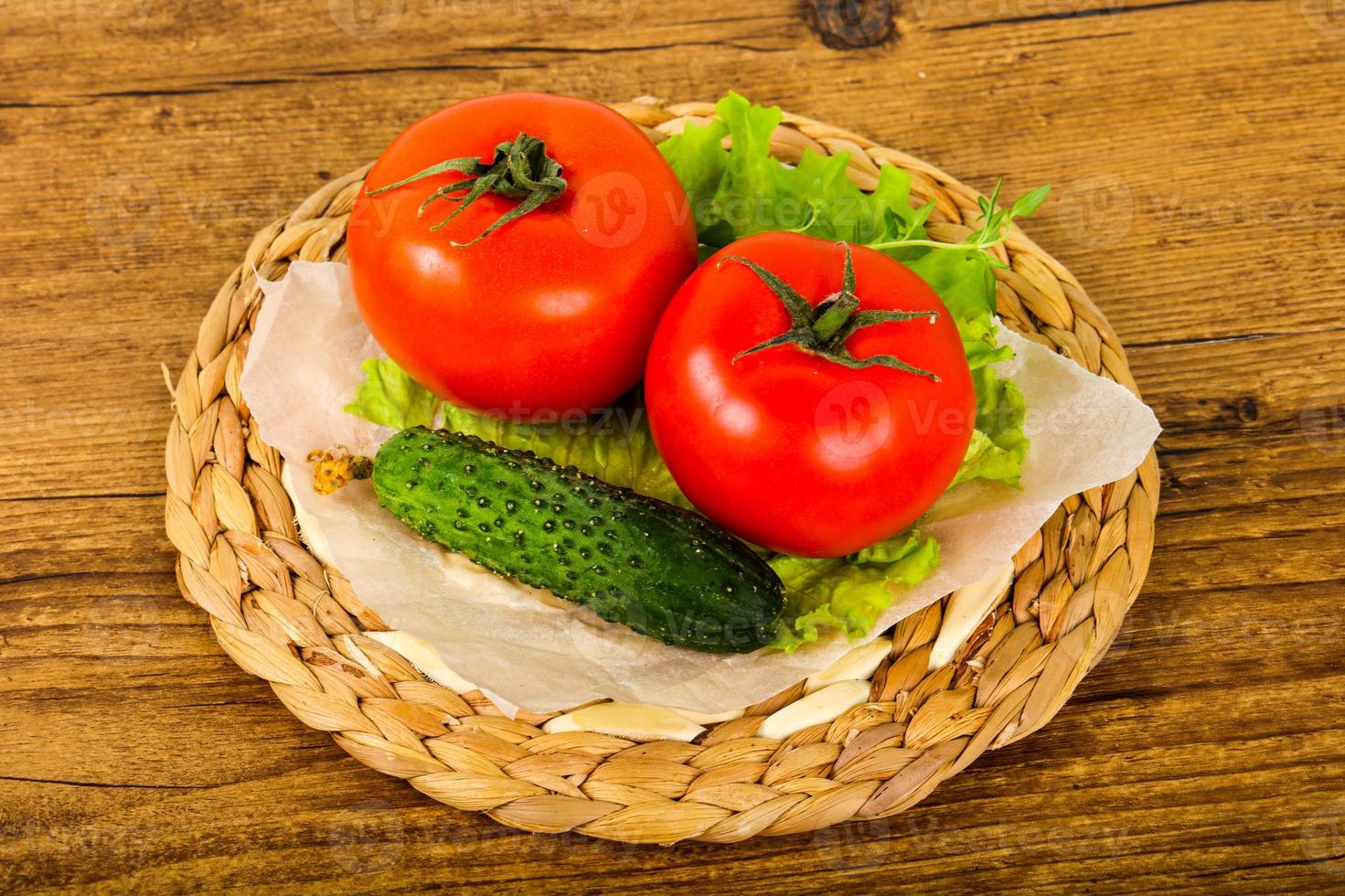 Cucumbers and tomatoes photo