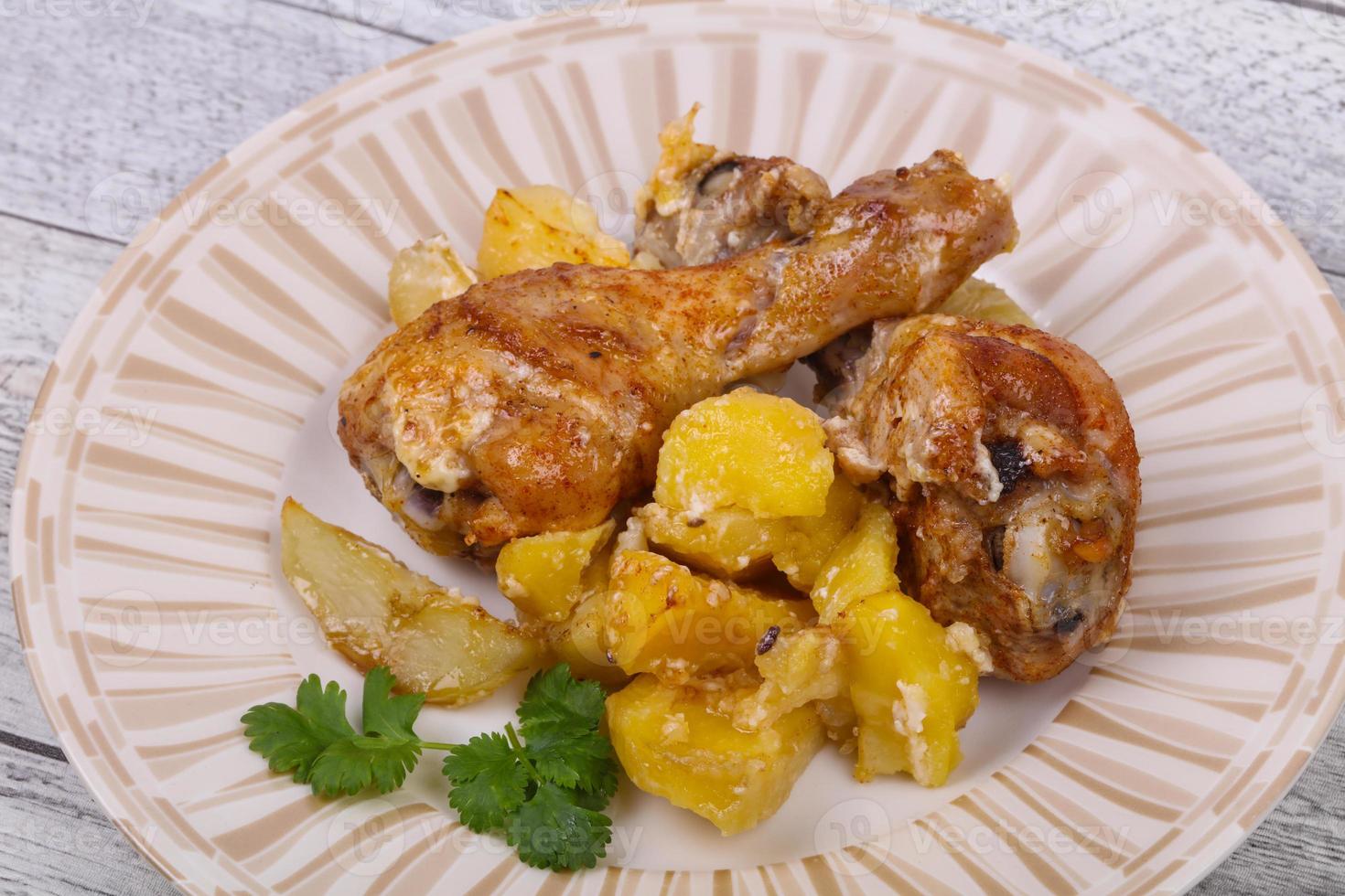 Roasted chicken legs with potato photo