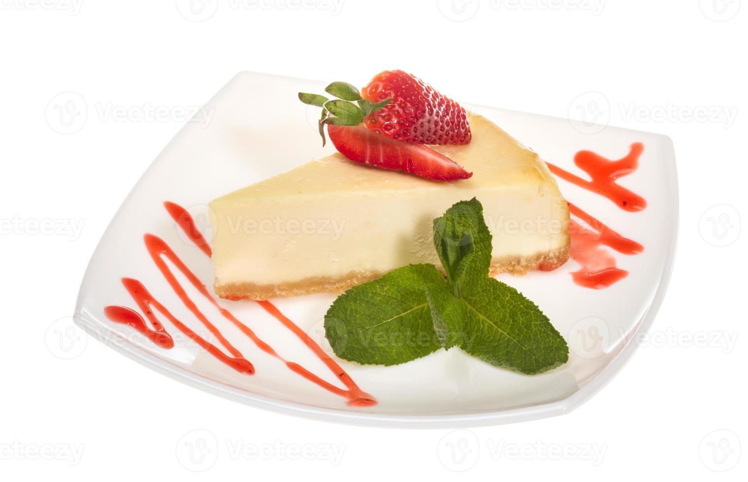 a piece of strawberry cheesecake on whit photo