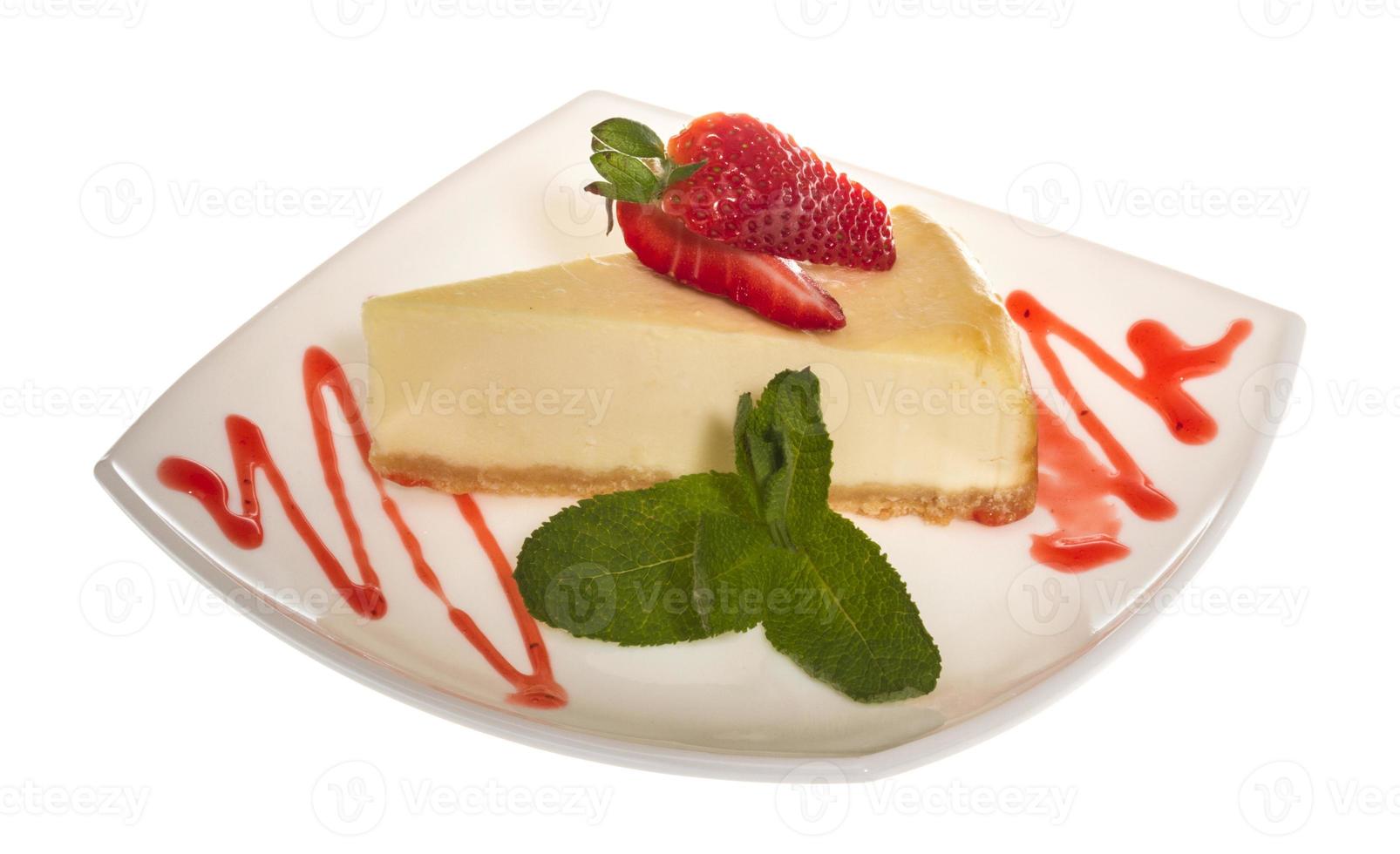 a piece of strawberry cheesecake on whit photo