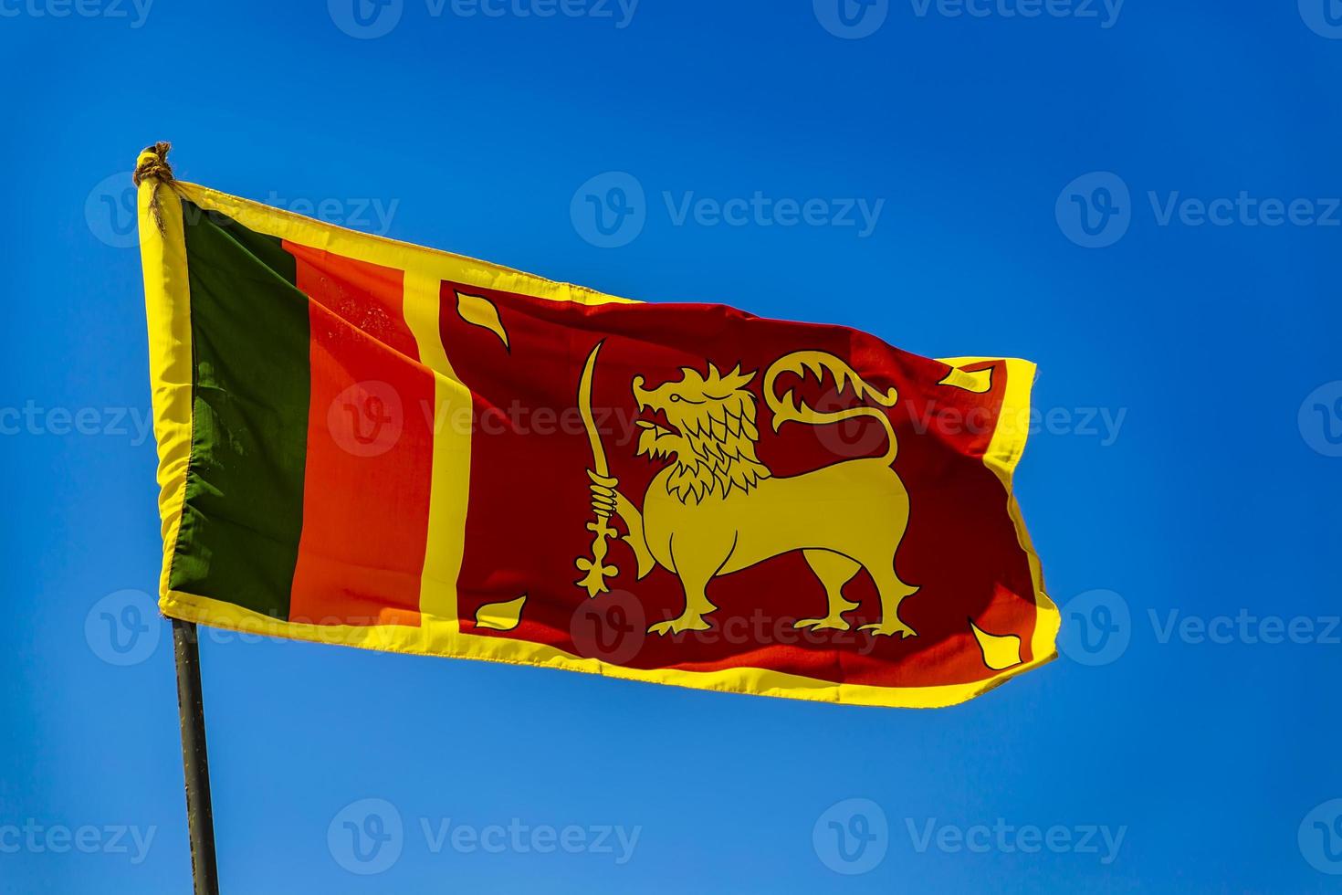 Sri Lankan flag against clear blue sky photo