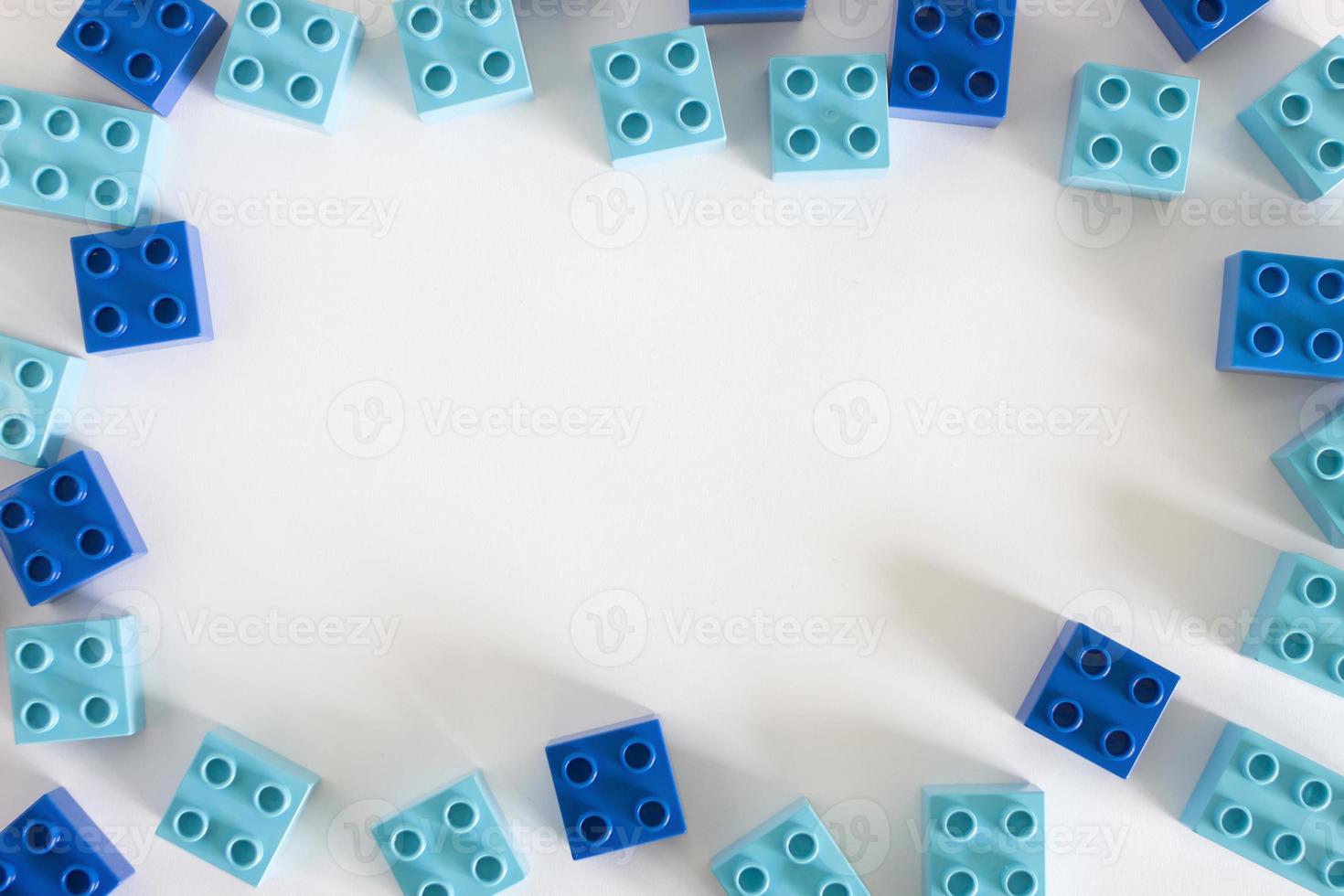 Blue plastic building blocks with empty copyspace photo