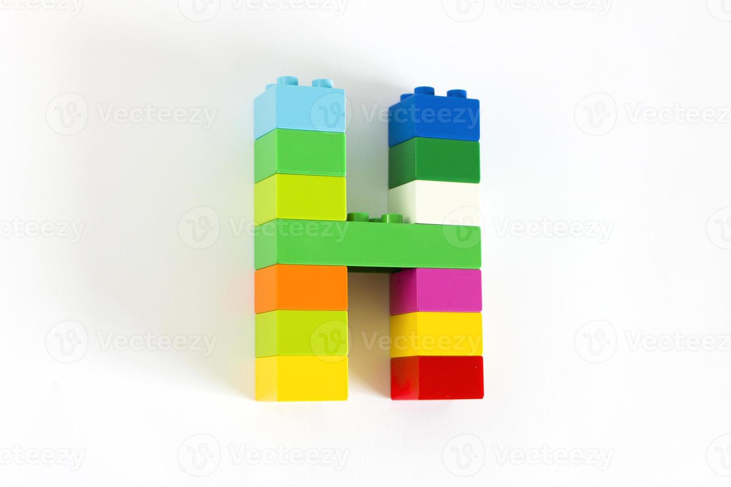 Colorful toy brick letter H photo