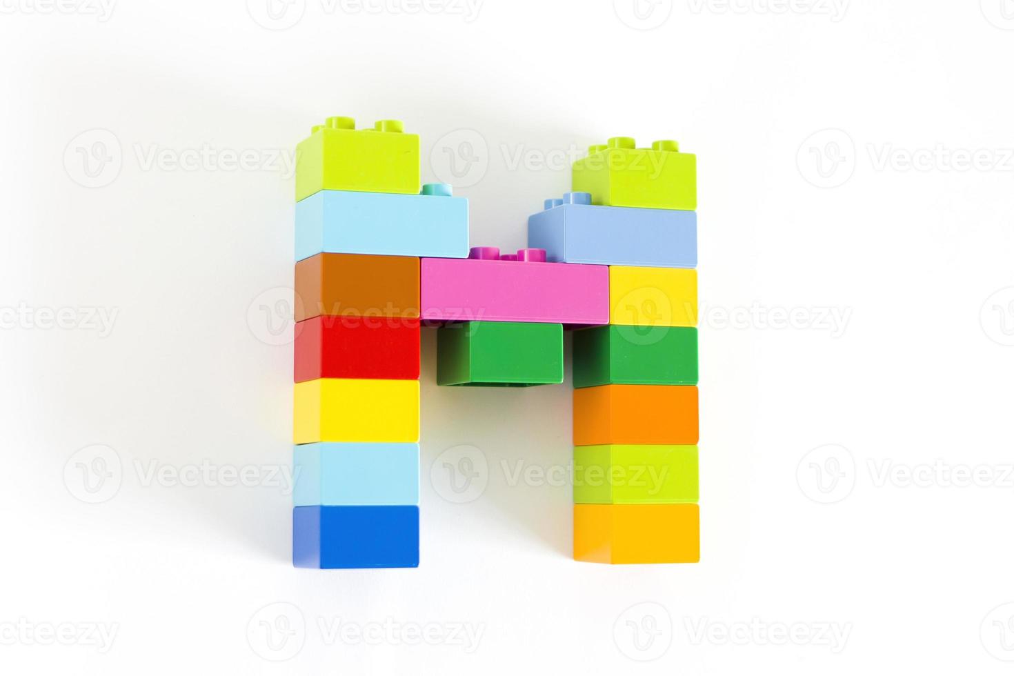 Colorful toy brick letter M photo