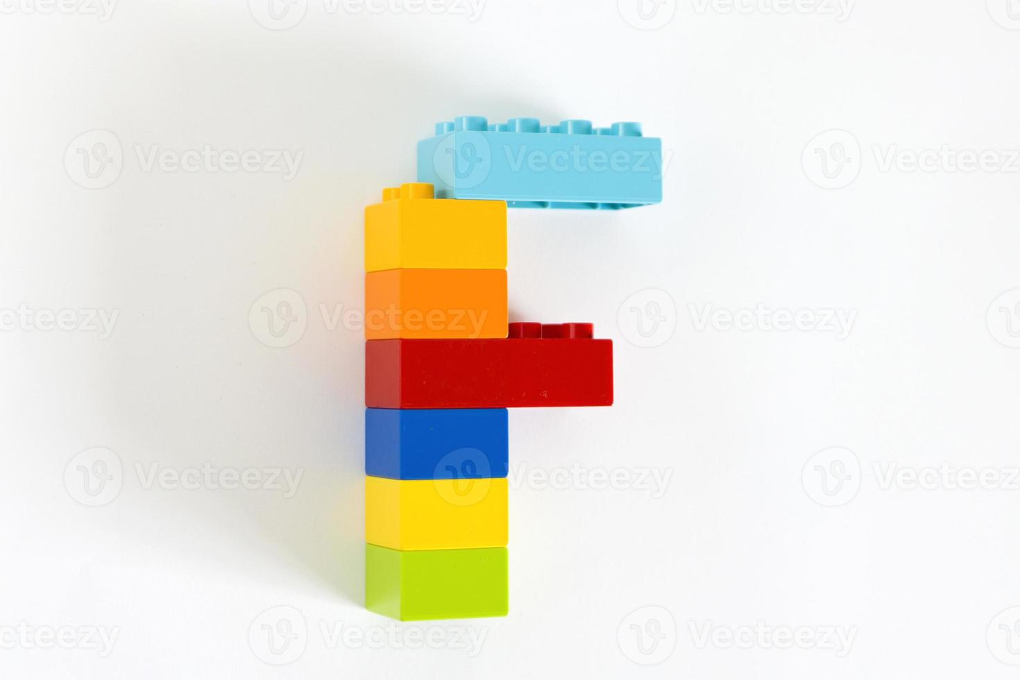 Colorful toy brick letter F photo