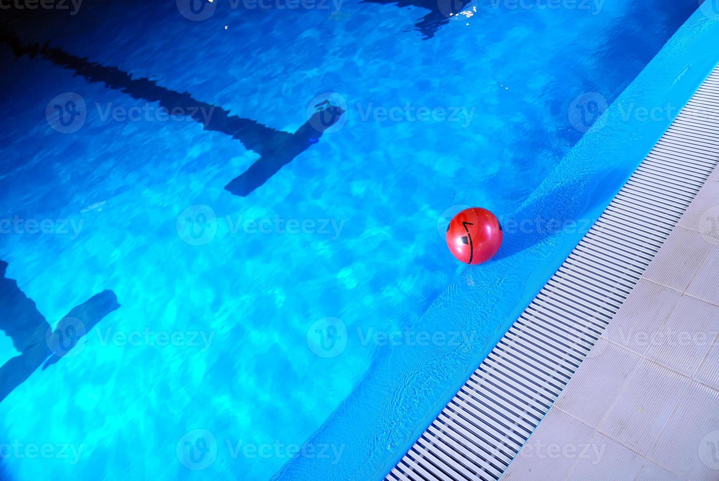 .red ball in swimming pool photo