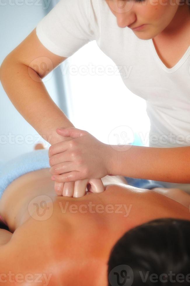 back massage at the spa and wellness center photo