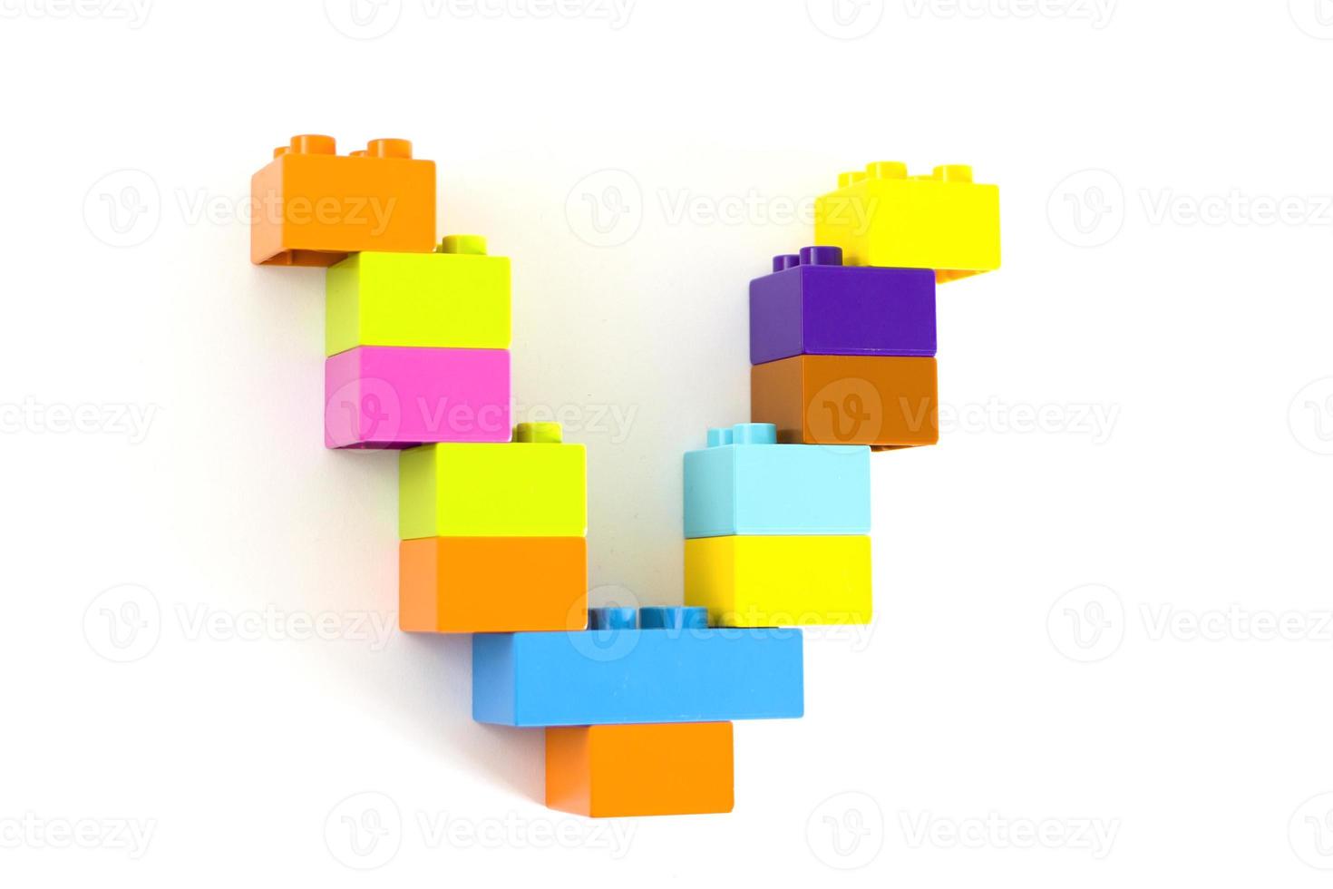 Colorful toy brick letter V photo