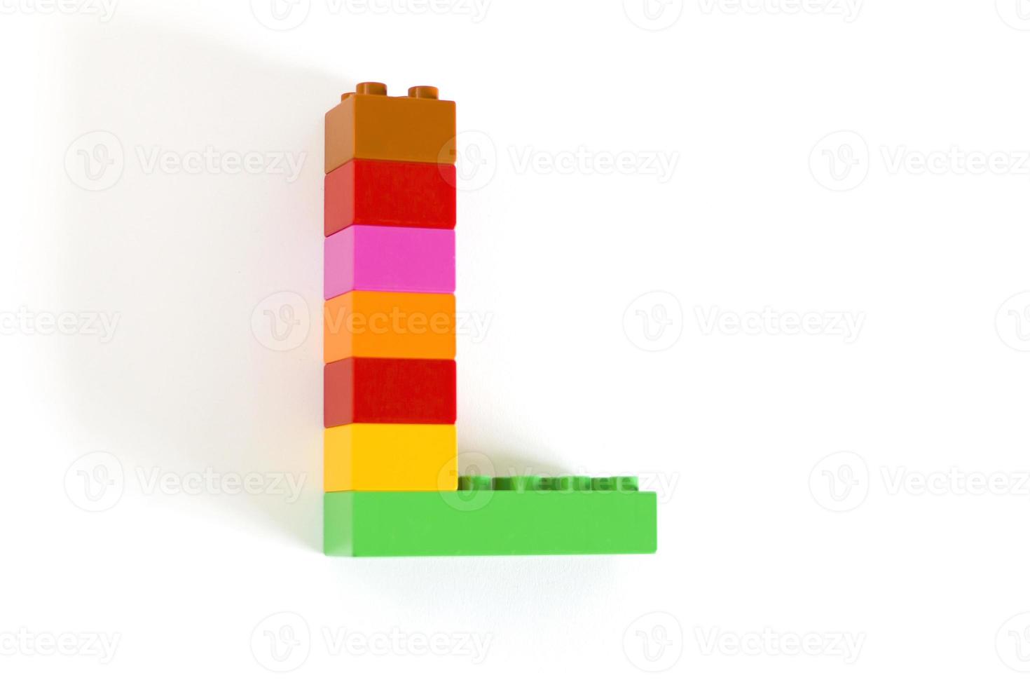 Colorful toy brick letter L photo