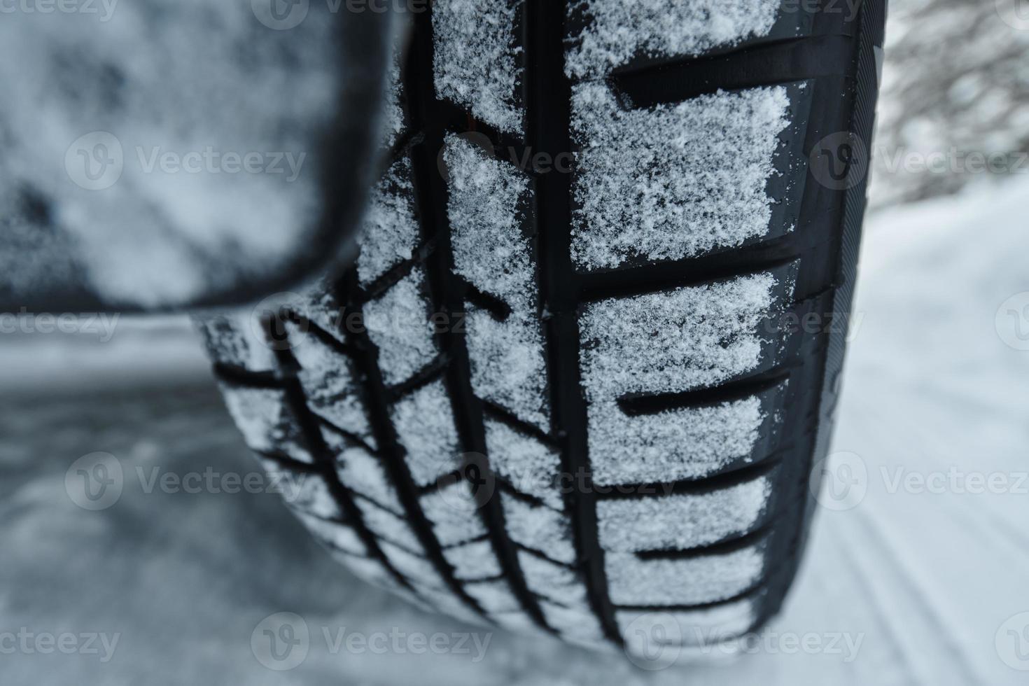 offroad suv car on icy winter north road photo