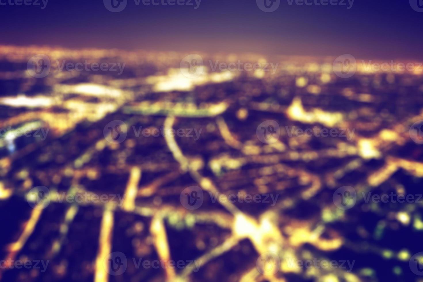 Big city night lights bokeh, blurred background. Vintage photo