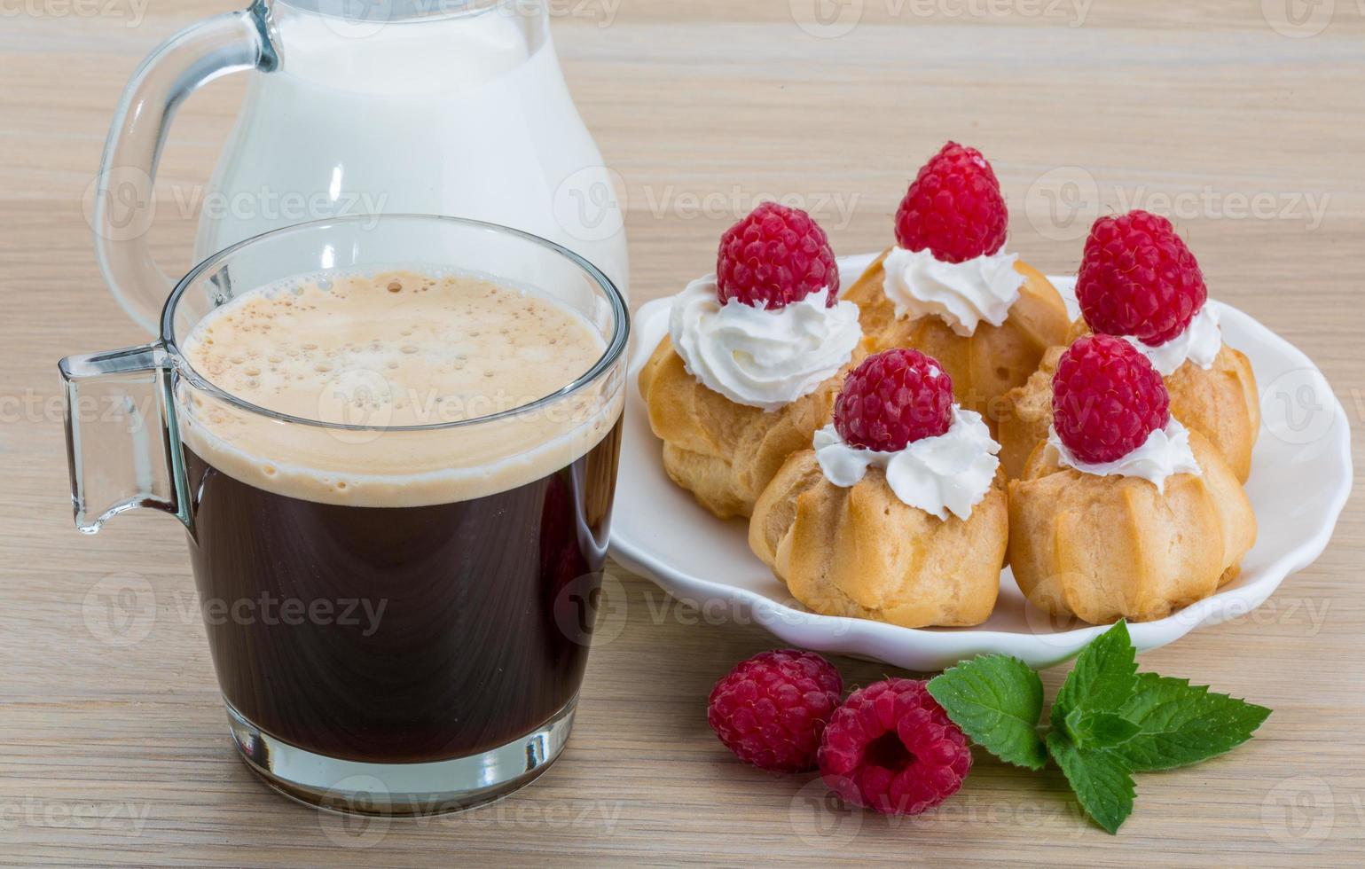 Profiterole with raspberry photo