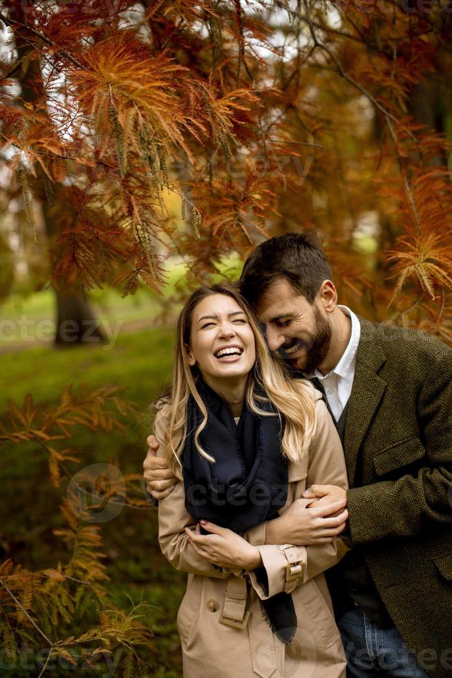Young couple in the autumn park photo