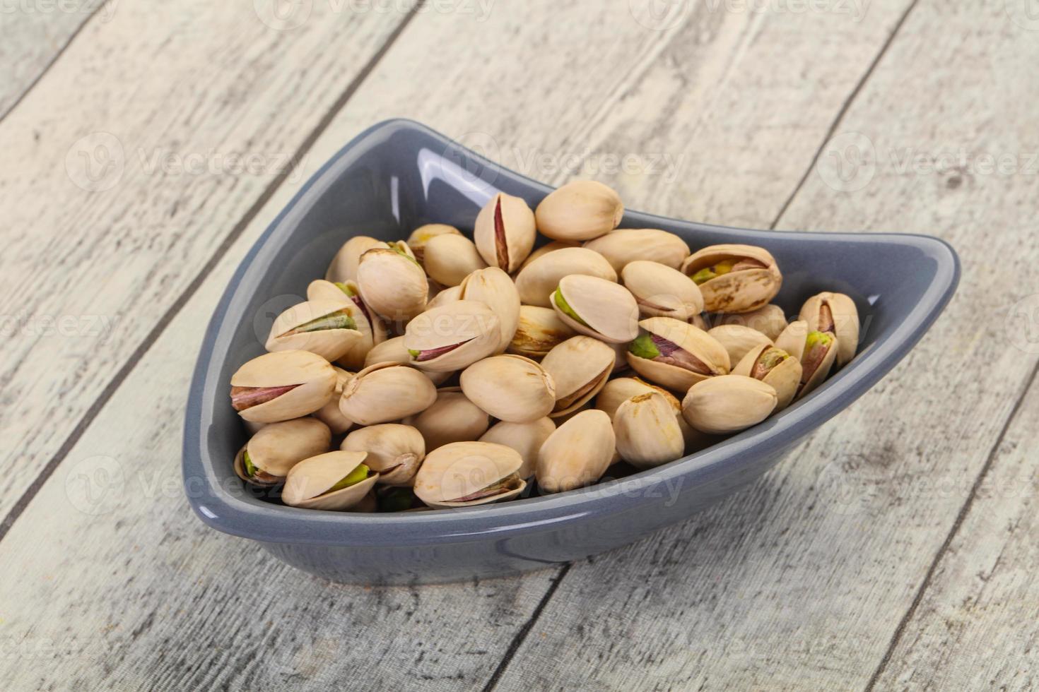 Pistachio nuts heap photo