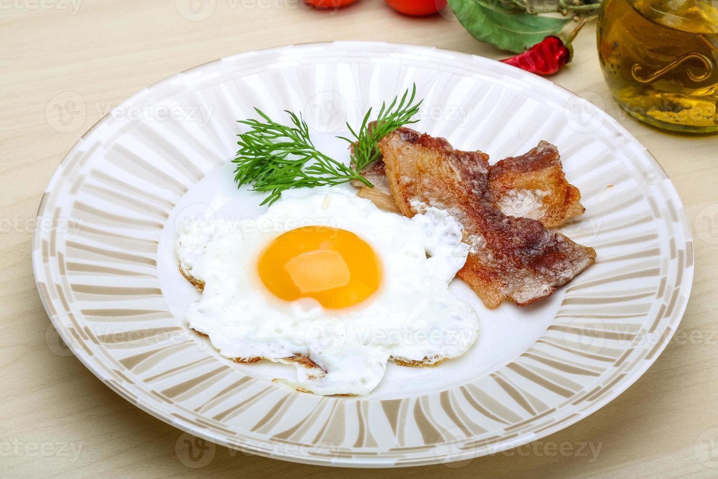 Breakfast - egg with bacon photo