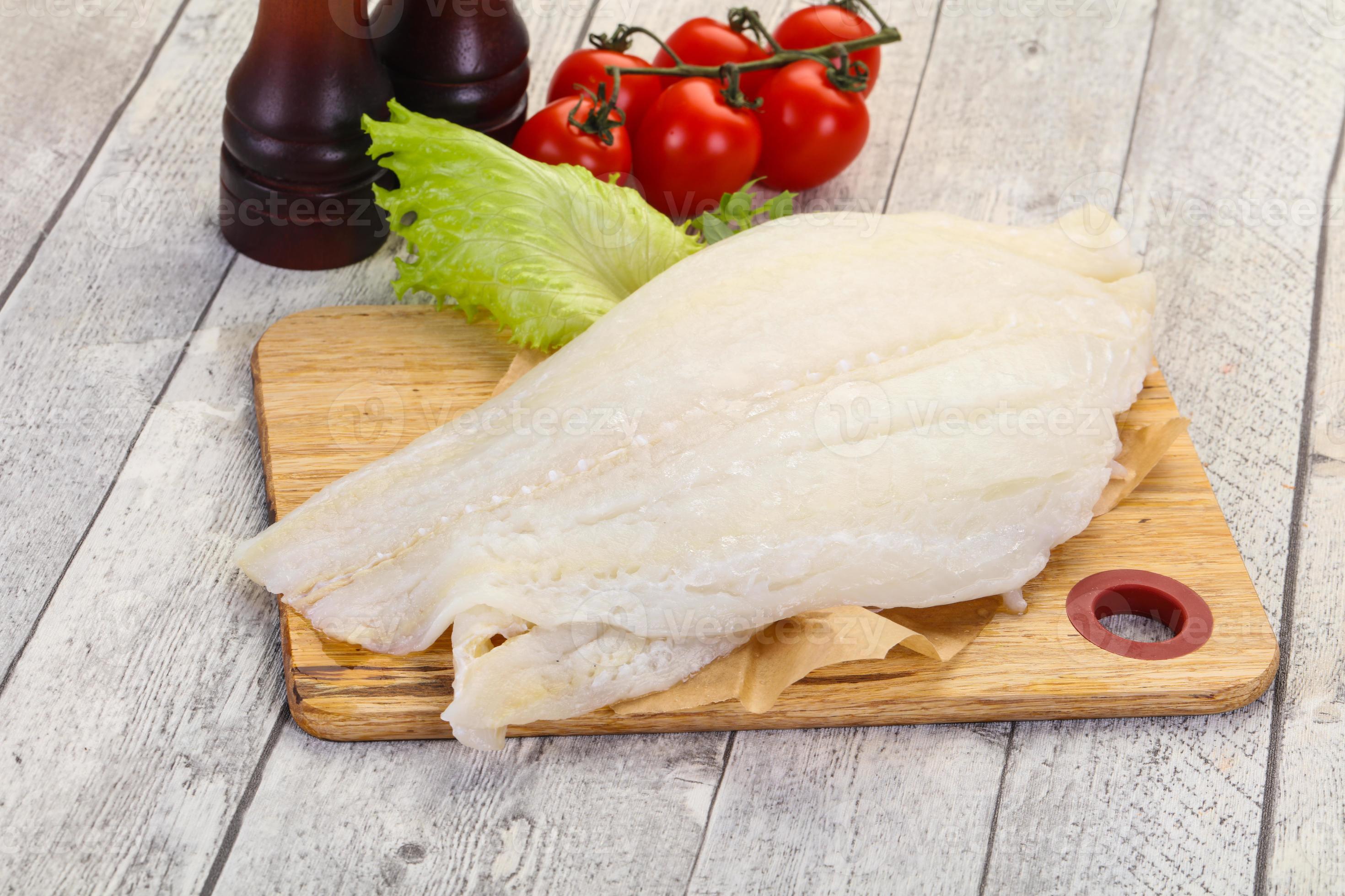 Raw halibut fillet 7866200 Stock Photo at Vecteezy