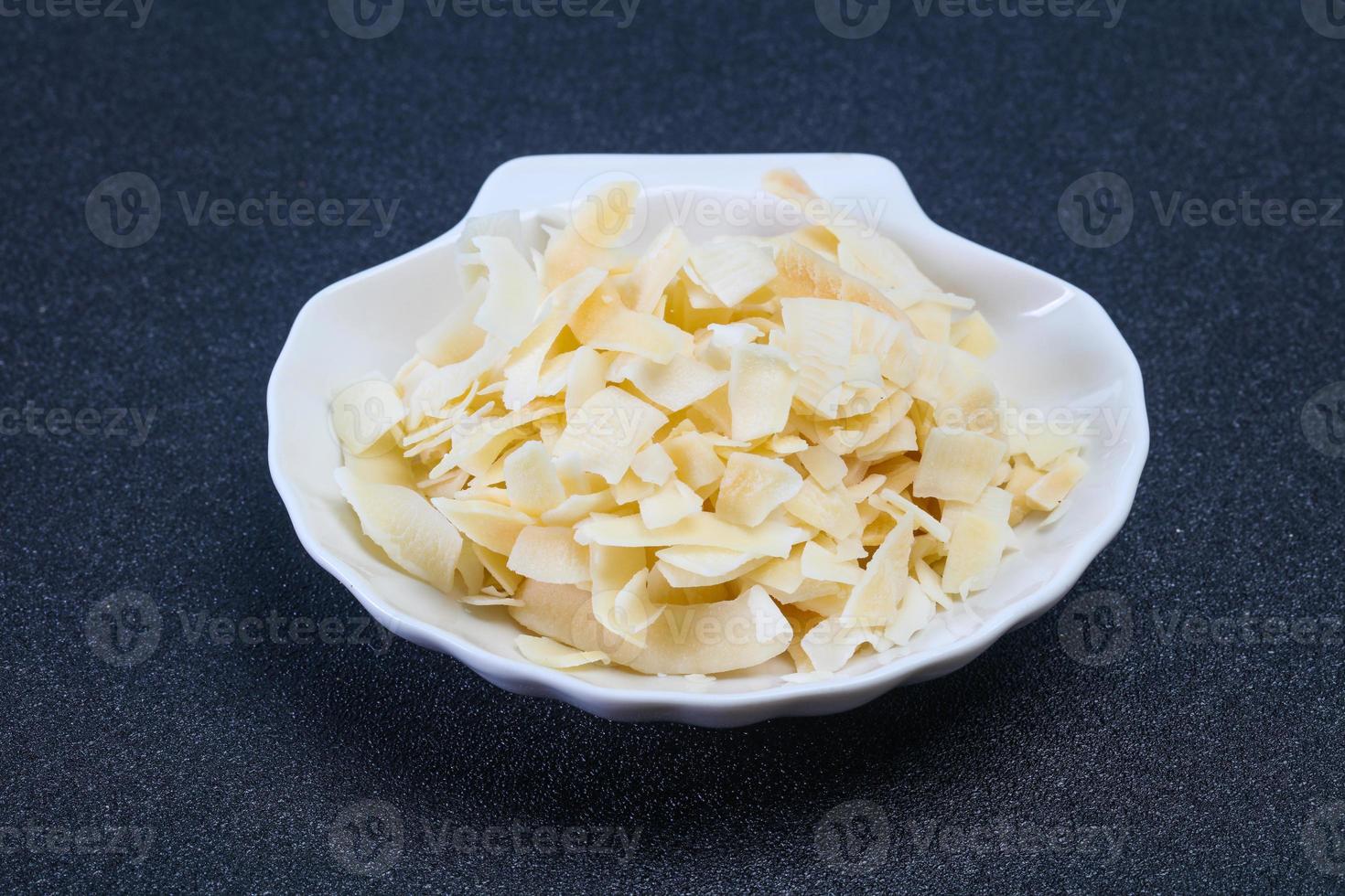 Coconut dry chips in the bowl photo