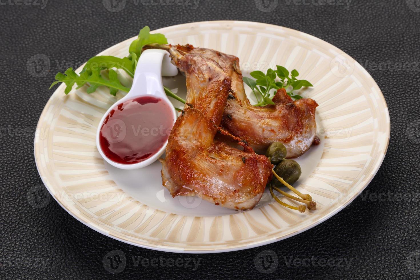 Roasted rabbit legs photo