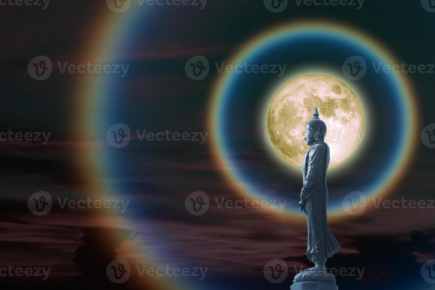 Moon corona rainbow light and Buddha looking seven day style on the night sky, Makha Bucha Day is held full moon day on february or march photo
