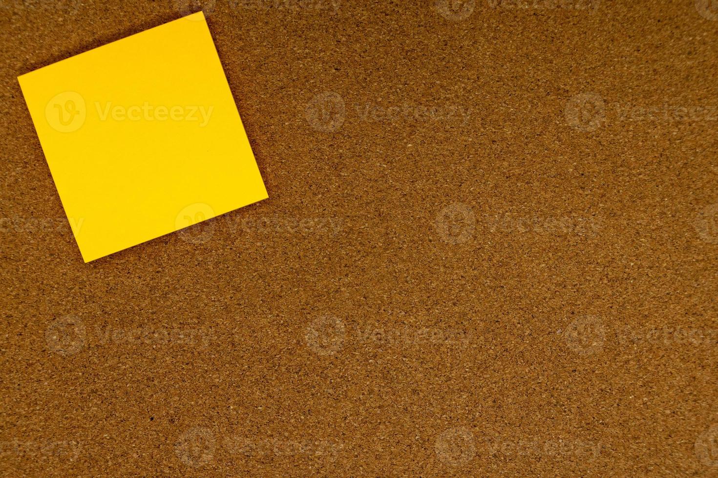 Abstract paper notes on a cork board. photo