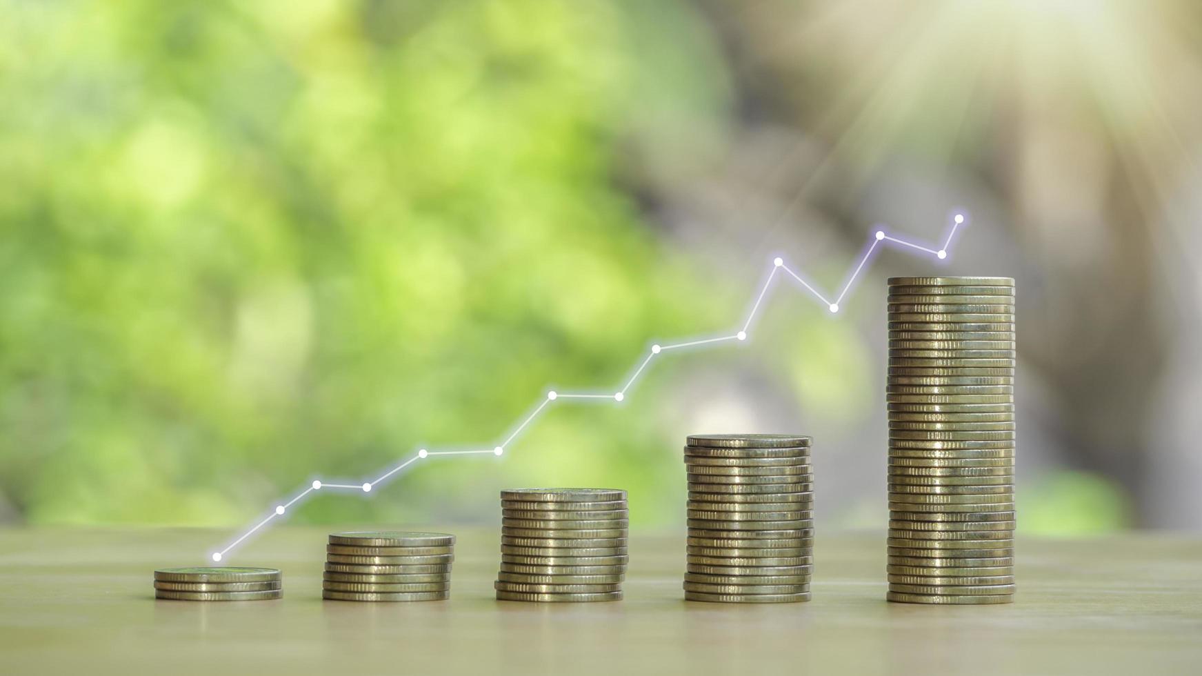Stock funding or money saving graph with golden coins to save the money invest for the future.Concept for loan, property ladder, financial, mortgage,real estate investment, chart financial investment. photo