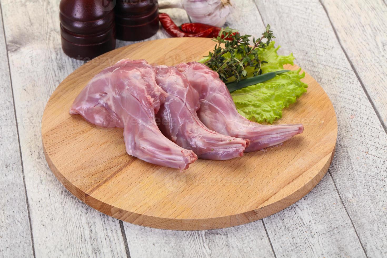 Raw rabbit legs photo