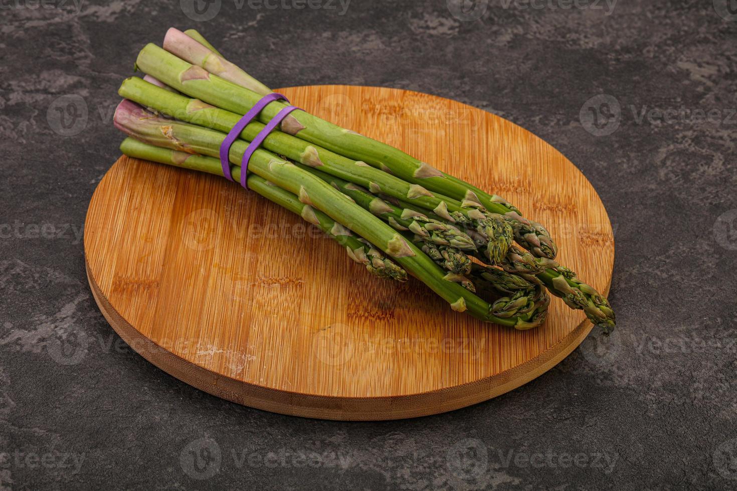 Vegan cuisine - Raw asparagus heap photo