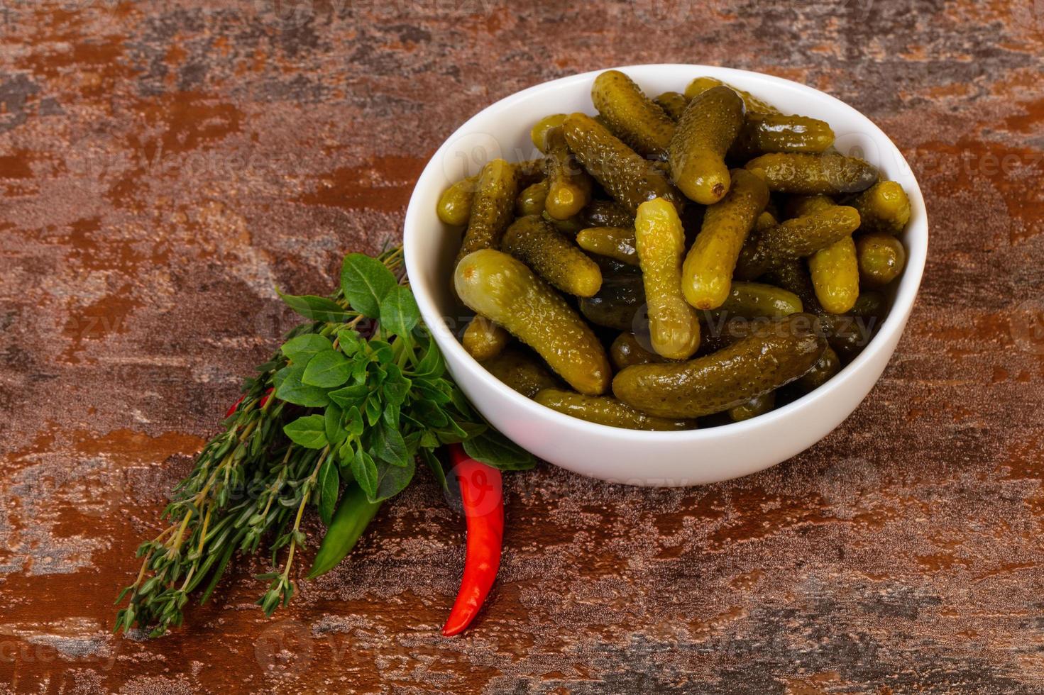 Pickled small cucumbers photo