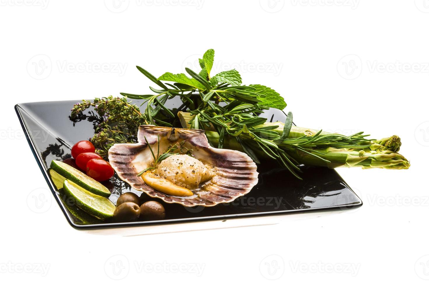 Scallop with asparagus, lime, mint and rosemary photo