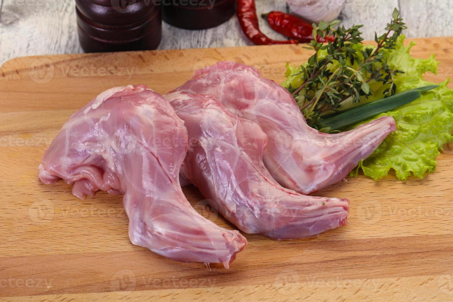 Raw rabbit legs photo