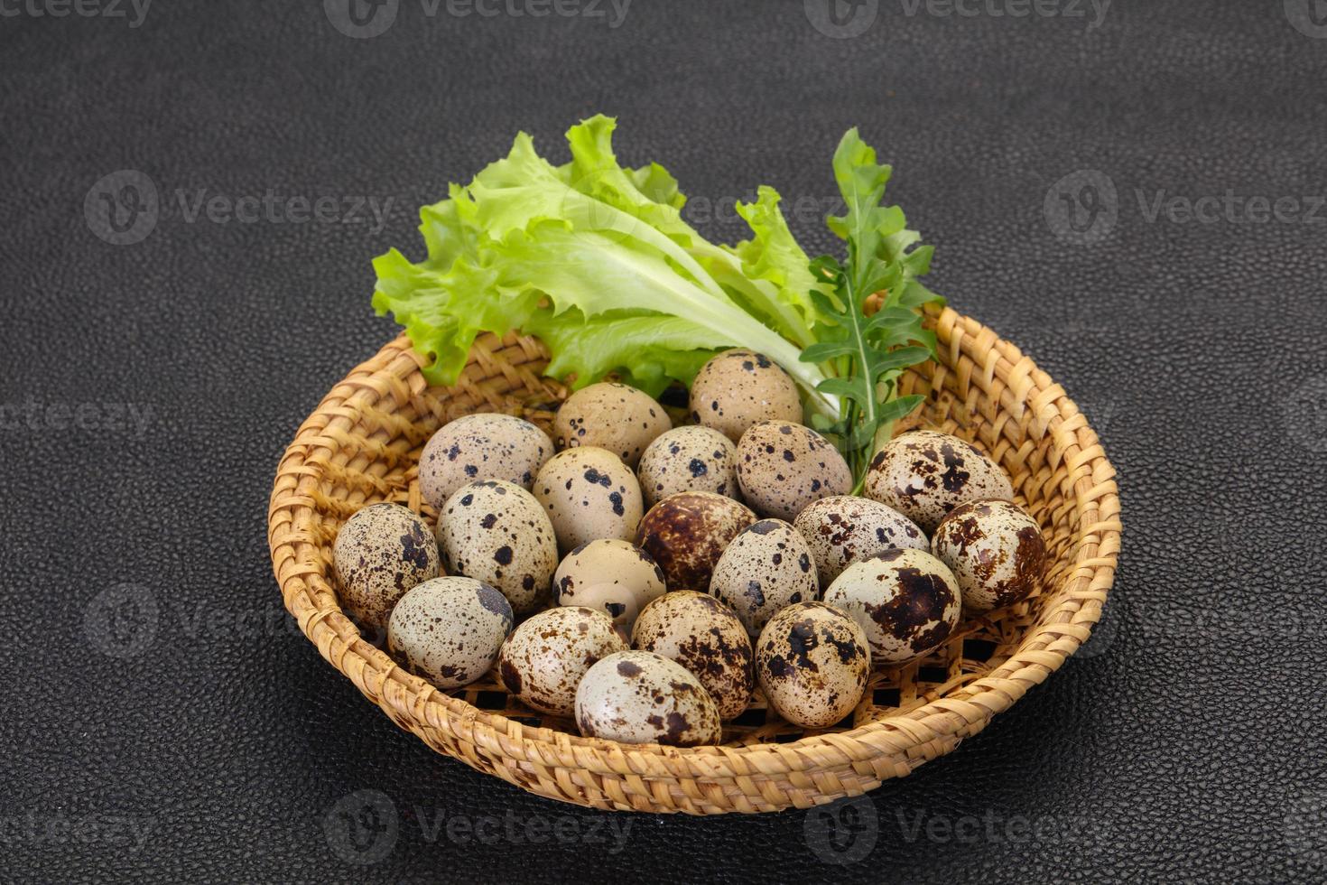 Quail eggs in the basket photo